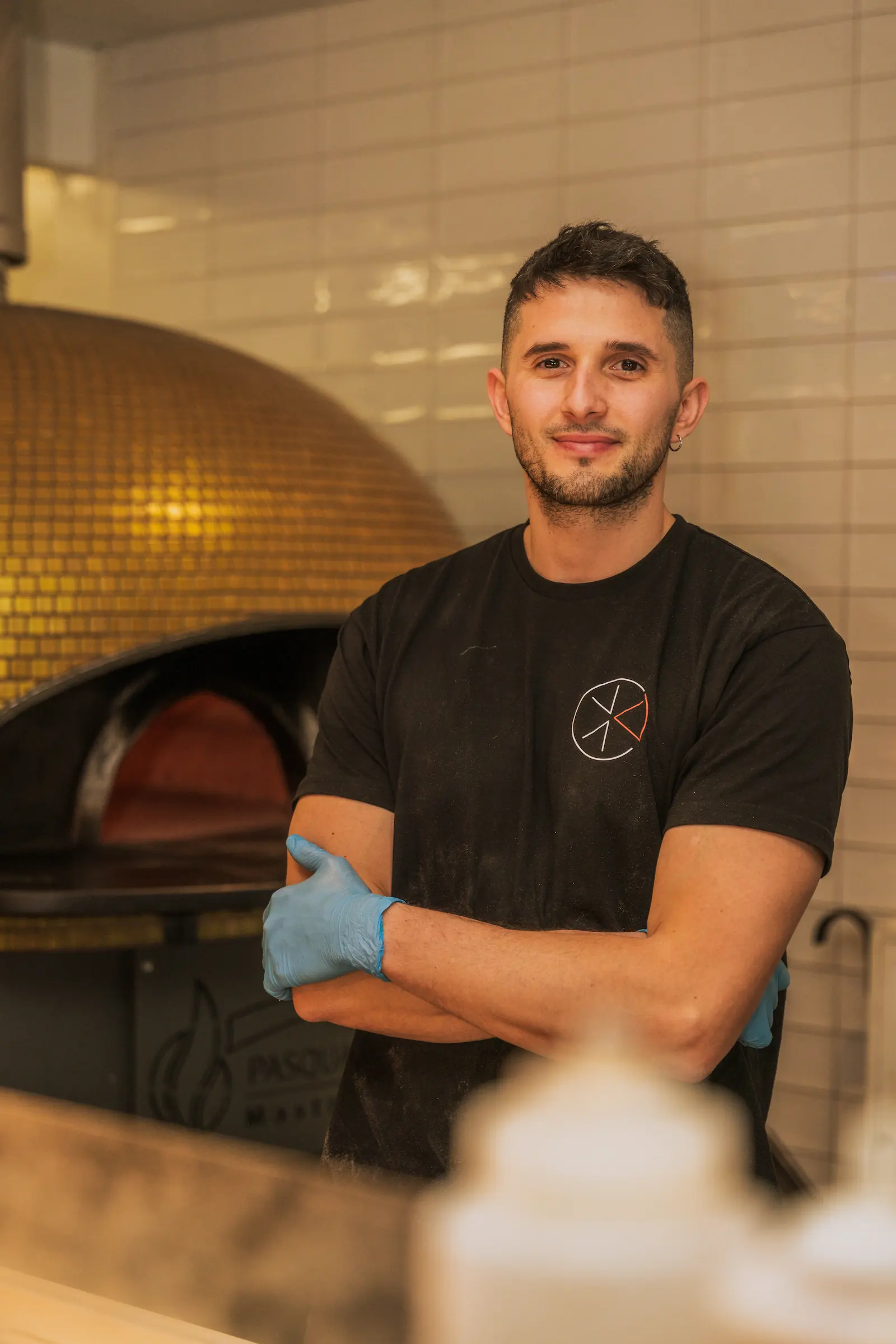 One of the chefs is smiling at the camera.
